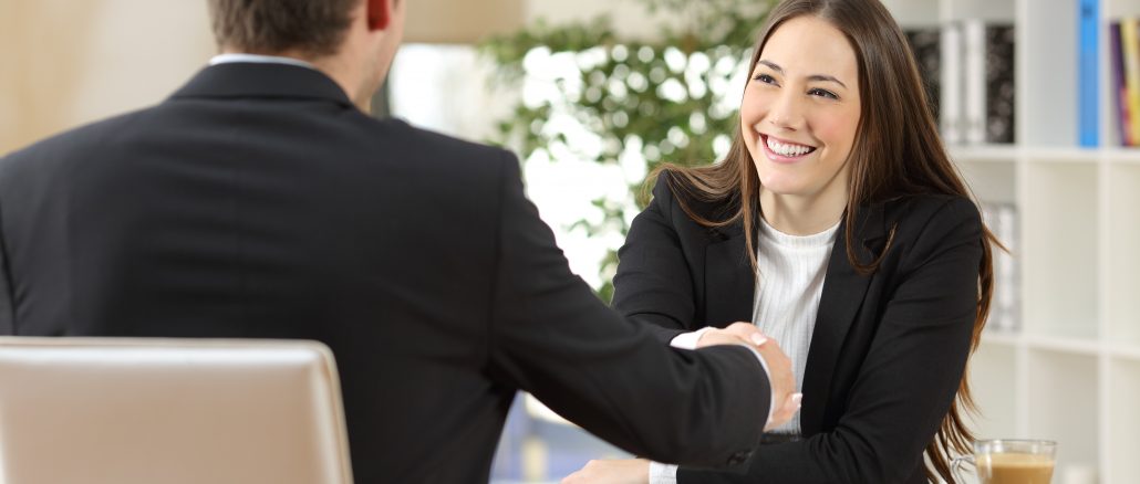 Businesspeople handshaking after negotiation